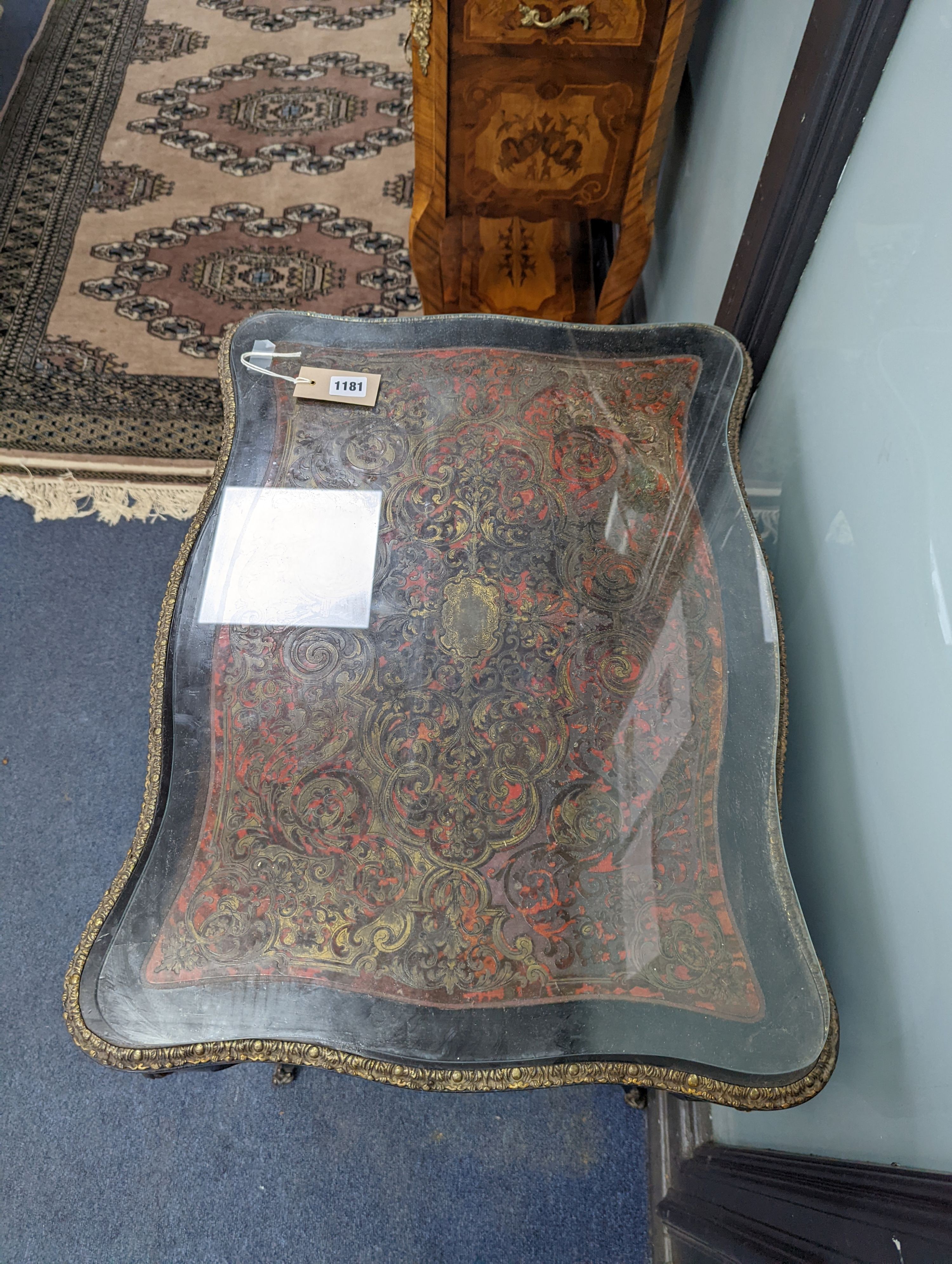 A 19th century French red Boullework poudreuse with mirrored internal lid and fitted interior, width 64cm, height 73cm